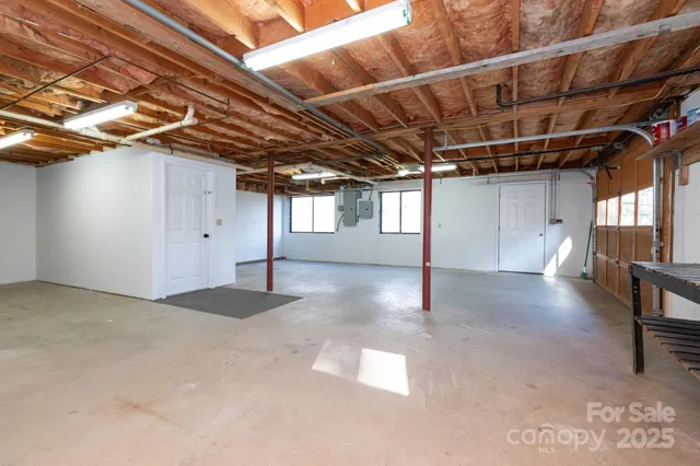 a kitchen with granite countertop a sink and a stove