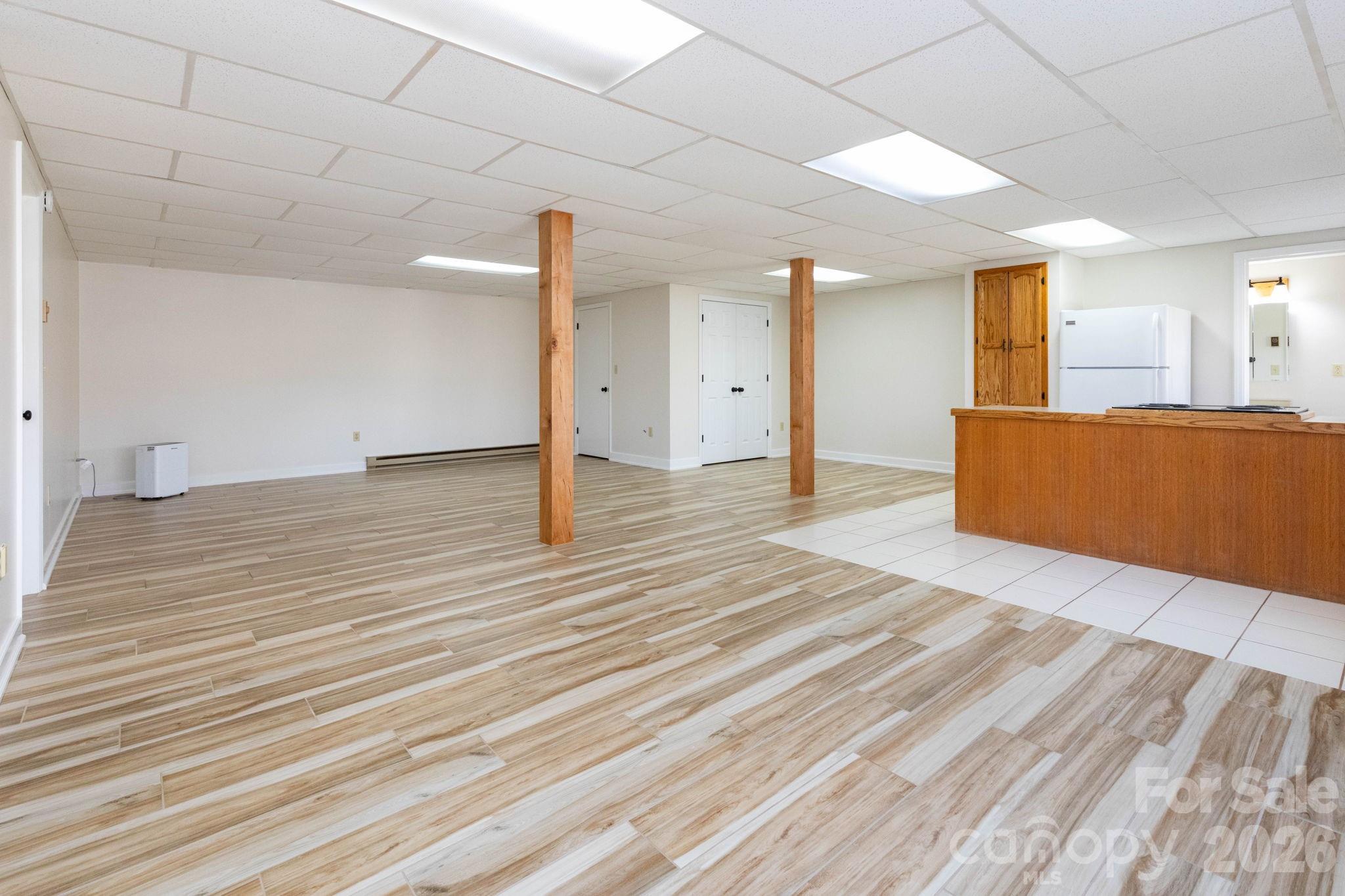 84 Joe Jenkins Road Fairview, NC 28730 - Photo 19 of 26 a view of empty room with wooden floor