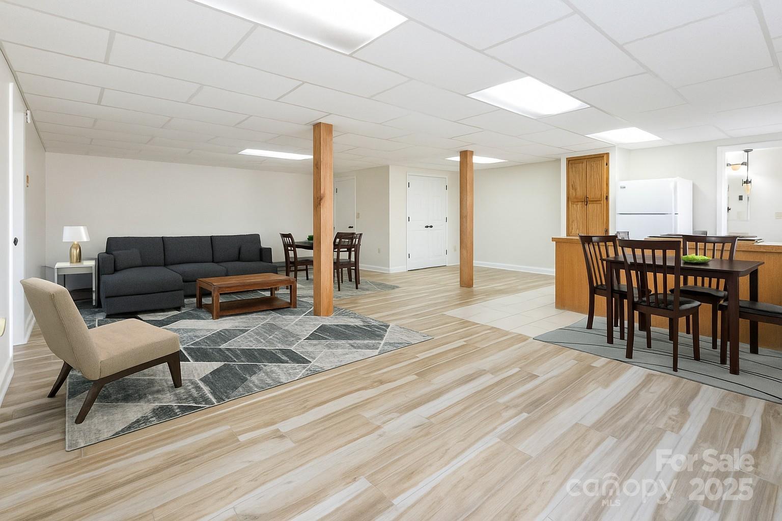 84 Joe Jenkins Road Fairview, NC 28730 - Photo 21 of 26 a living room with furniture and a wooden floor