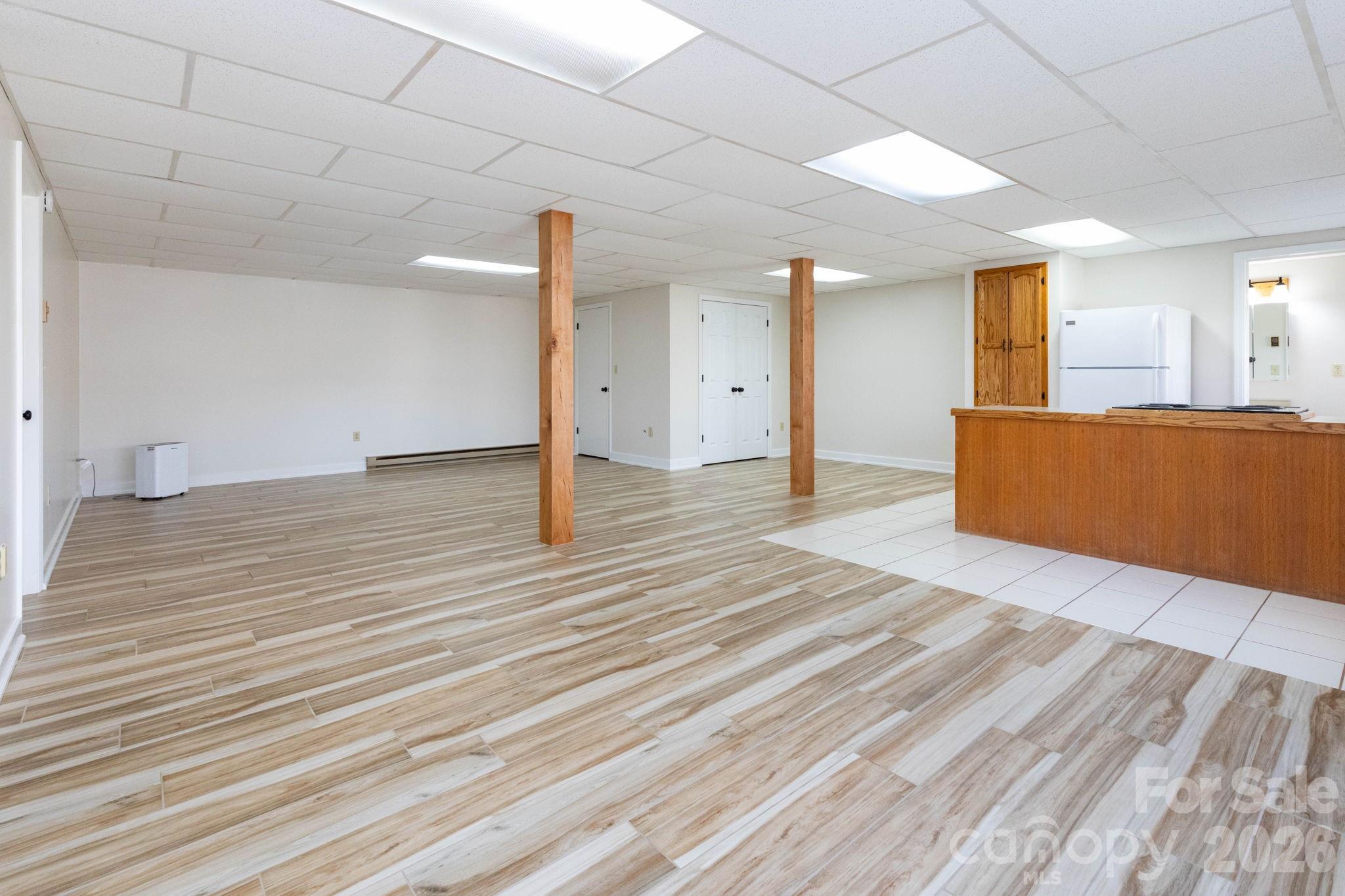 84 Joe Jenkins Road Fairview, NC 28730 - Photo 26 of 26 a view of empty room with wooden floor