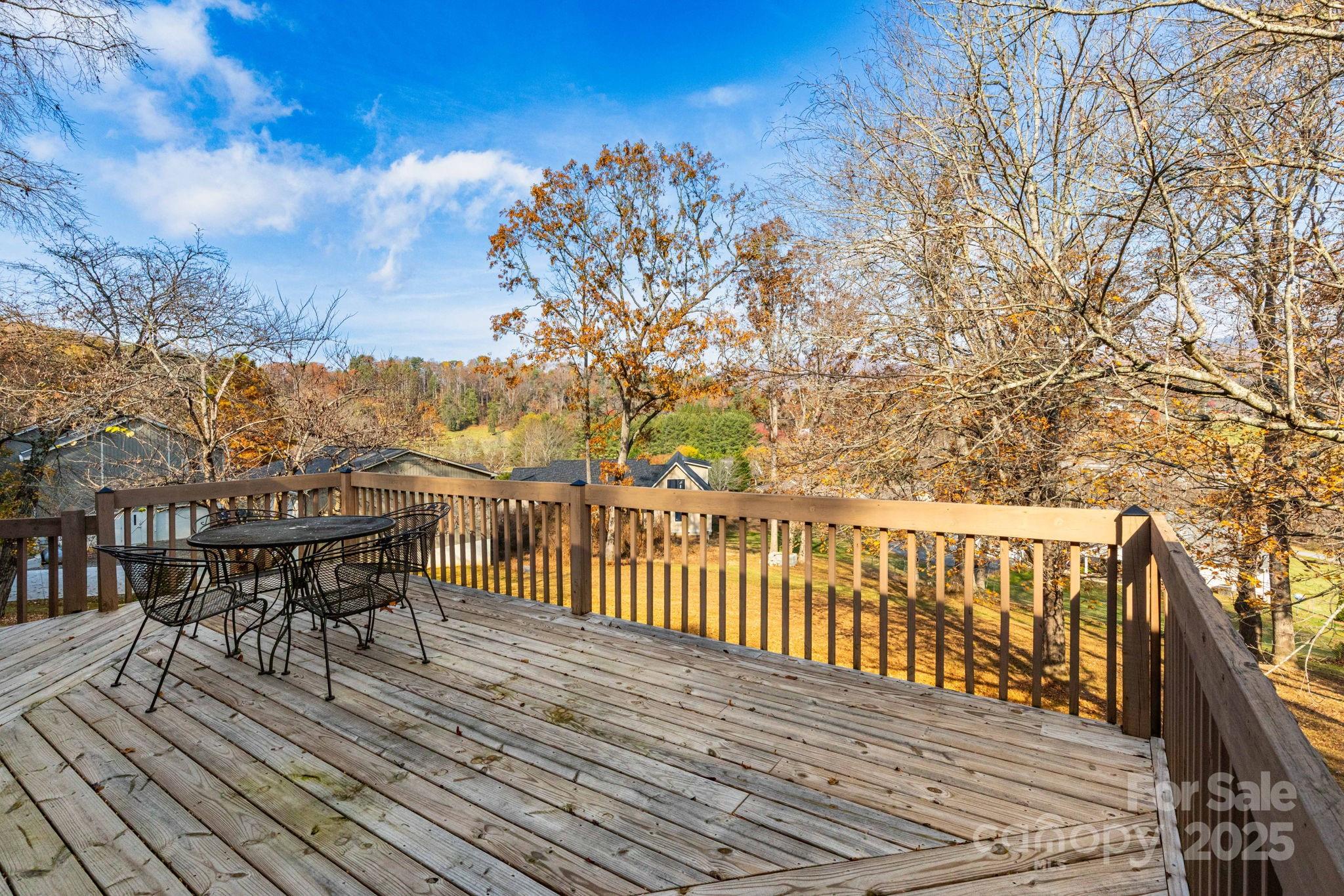 84 Joe Jenkins Road Fairview, NC 28730 - Photo 7 of 26 a view of a balcony with chairs
