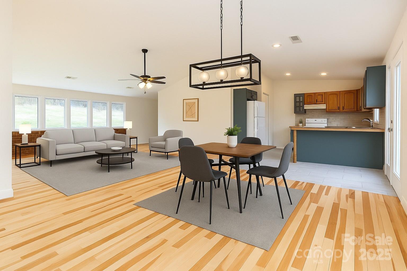 84 Joe Jenkins Road Fairview, NC 28730 - Photo 9 of 26 a view of a dining room with furniture and wooden floor