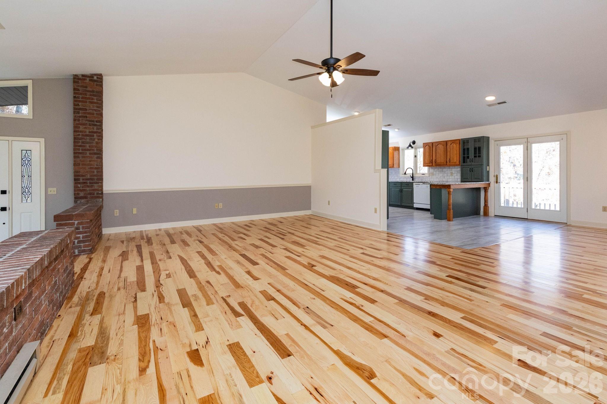 84 Joe Jenkins Road Fairview, NC 28730 - Photo 10 of 26 a view of empty room with wooden floor and window
