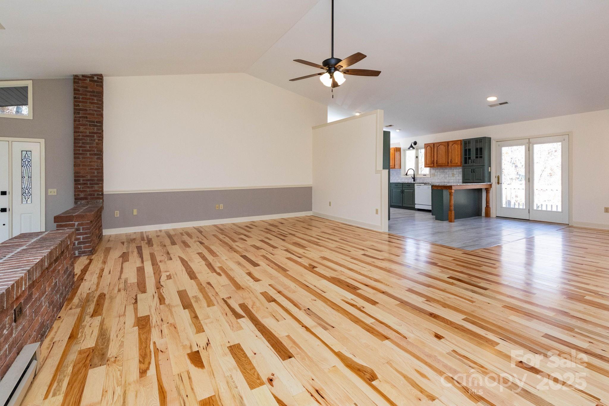 84 Joe Jenkins Road Fairview, NC 28730 - Photo 10 of 26 a view of empty room with wooden floor and window