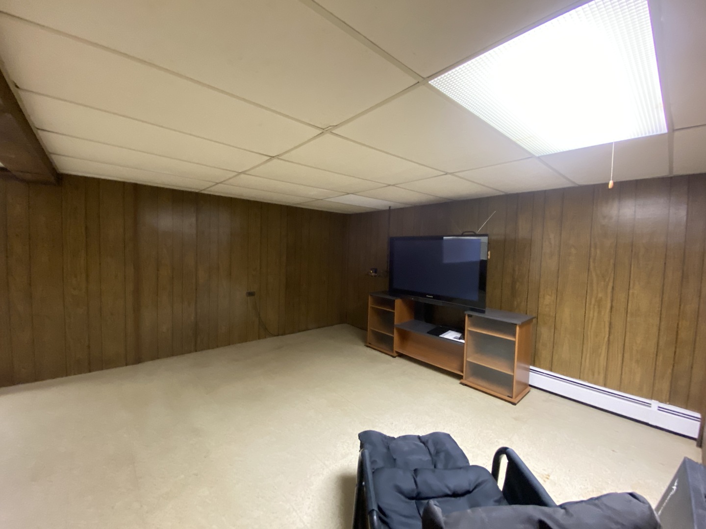 2050 Atwood Avenue Berkeley, IL 60163 - Photo 16 of 23 a living room with furniture and a flat screen tv