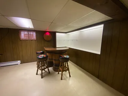 a view of a workspace with furniture