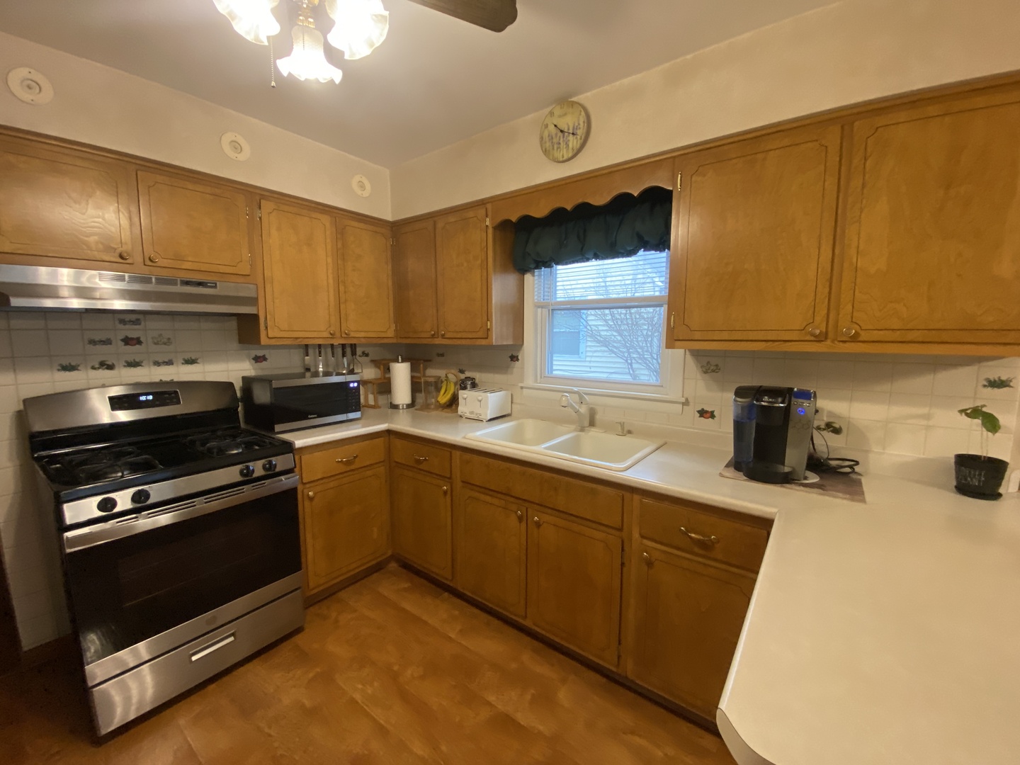 2050 Atwood Avenue Berkeley, IL 60163 - Photo 5 of 23 a kitchen with a sink appliances and cabinets