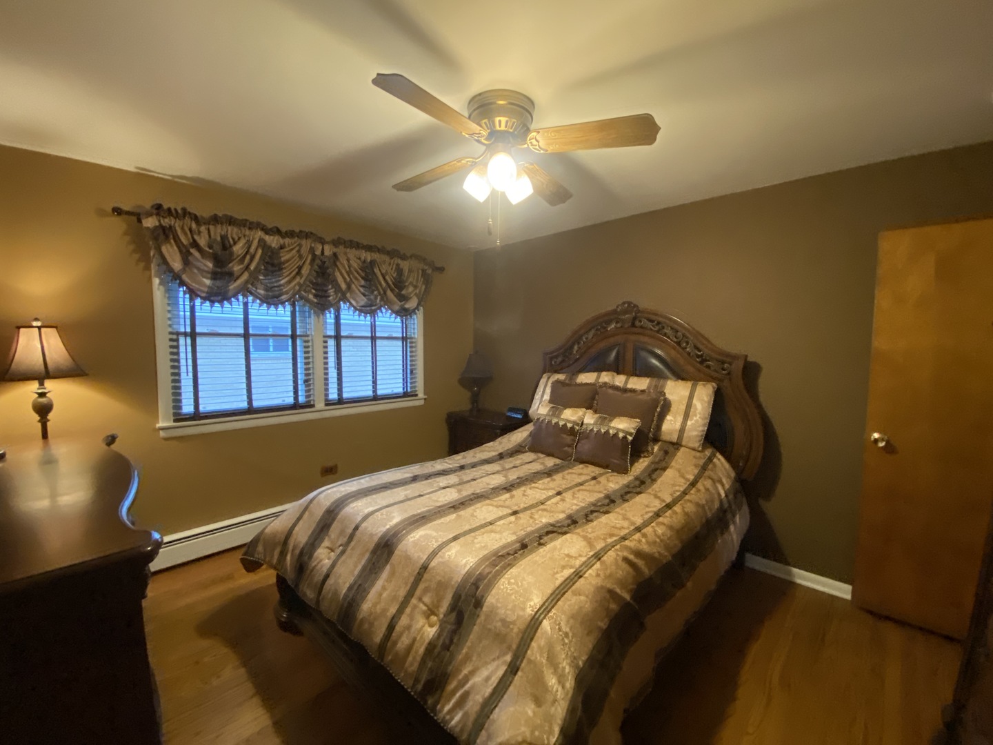 2050 Atwood Avenue Berkeley, IL 60163 - Photo 9 of 23 a bedroom with a bed and a window