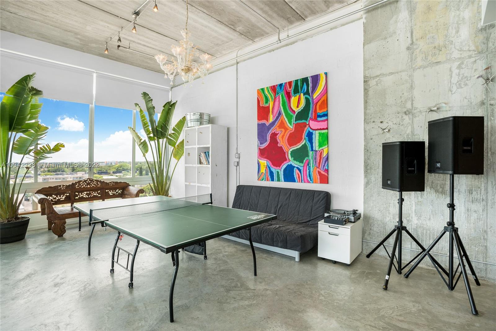 8101 Biscayne Boulevard, Unit R705 Miami, FL 33138 - Photo 12 of 32 a view of a dining room with furniture and chandelier
