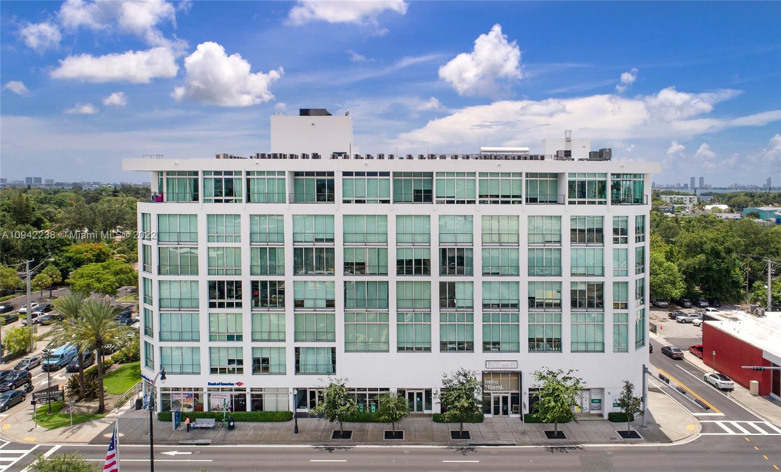 8101 Biscayne Boulevard, Unit R705 Miami, FL 33138 - Photo 20 of 32 a view of a building with a garden and pathway