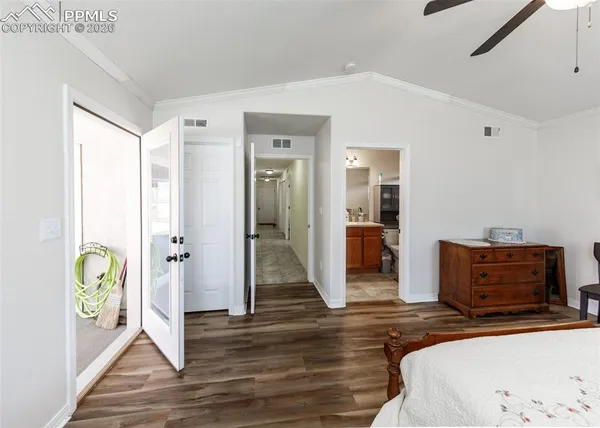 a bedroom with a bed and a walk in closet