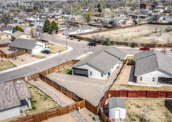 an aerial view of residential houses with outdoor space