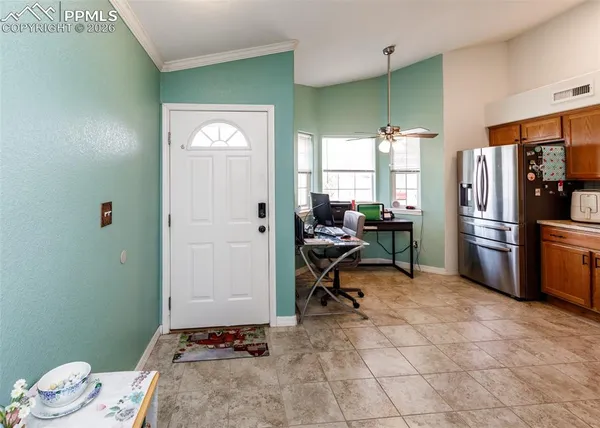a kitchen with a refrigerator and a sink