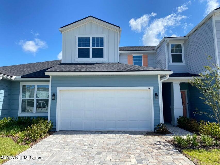 534 Pine Bluff Drive St. Augustine, FL 32092 - Photo 1 of 30 a front view of a house with a yard