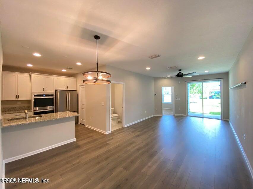 534 Pine Bluff Drive St. Augustine, FL 32092 - Photo 13 of 30 a view of a kitchen with a sink and microwave