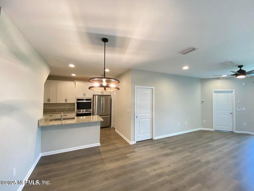 534 Pine Bluff Drive St. Augustine, FL 32092 - Photo 14 of 30 a view of a kitchen with a sink and microwave