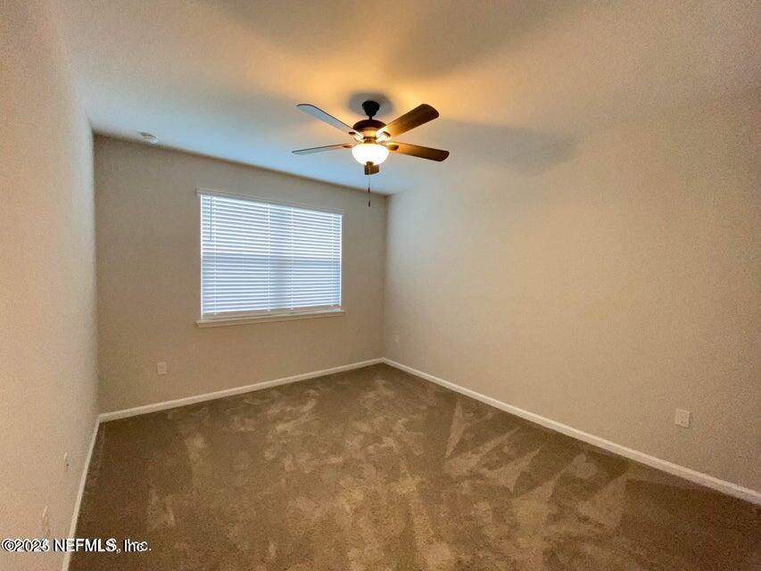 534 Pine Bluff Drive St. Augustine, FL 32092 - Photo 22 of 30 an empty room with windows and fan