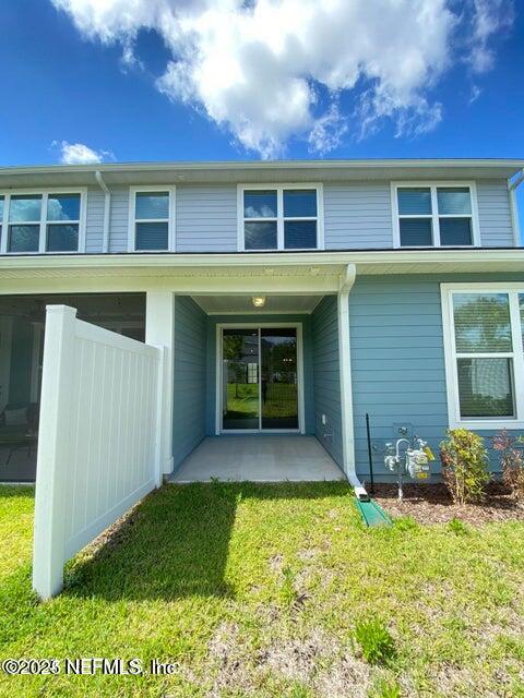 534 Pine Bluff Drive St. Augustine, FL 32092 - Photo 4 of 30 a front view of a house with a yard