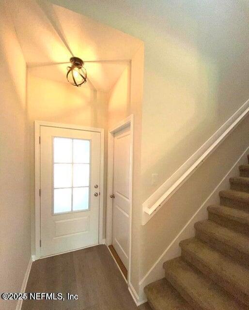 534 Pine Bluff Drive St. Augustine, FL 32092 - Photo 7 of 30 a view of a room with wooden floor and windows