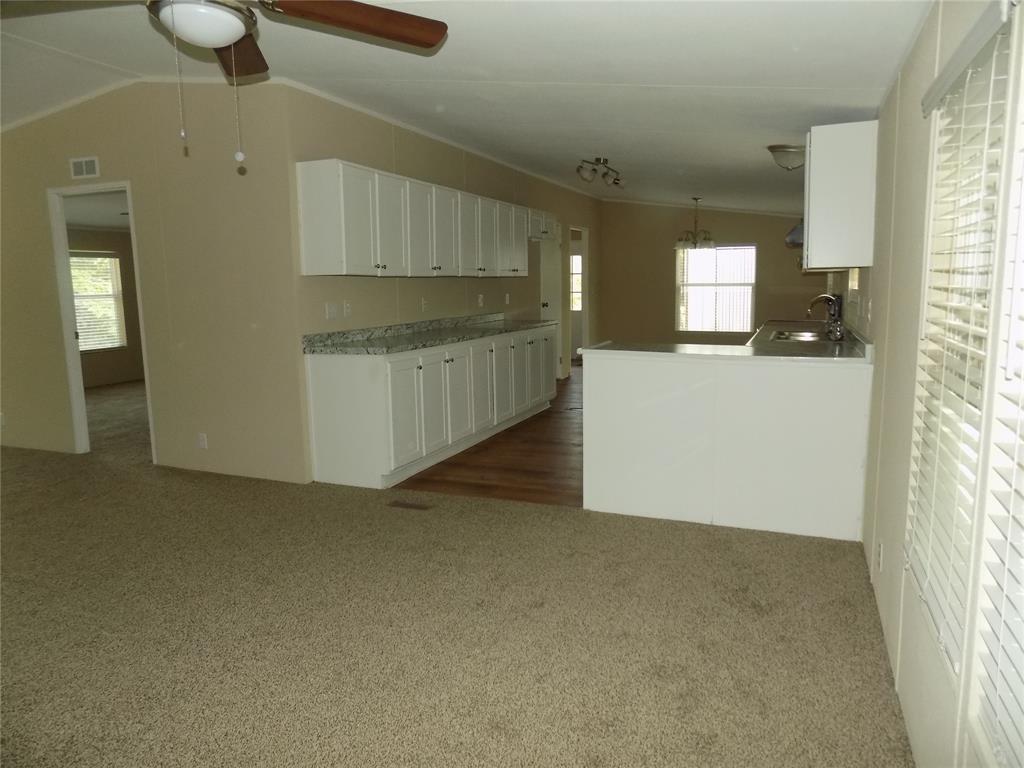 203 South Ridgeview Court Azle, TX 76020 - Photo 4 of 29 Looking into spacious kitchen with excellent cabinet space.