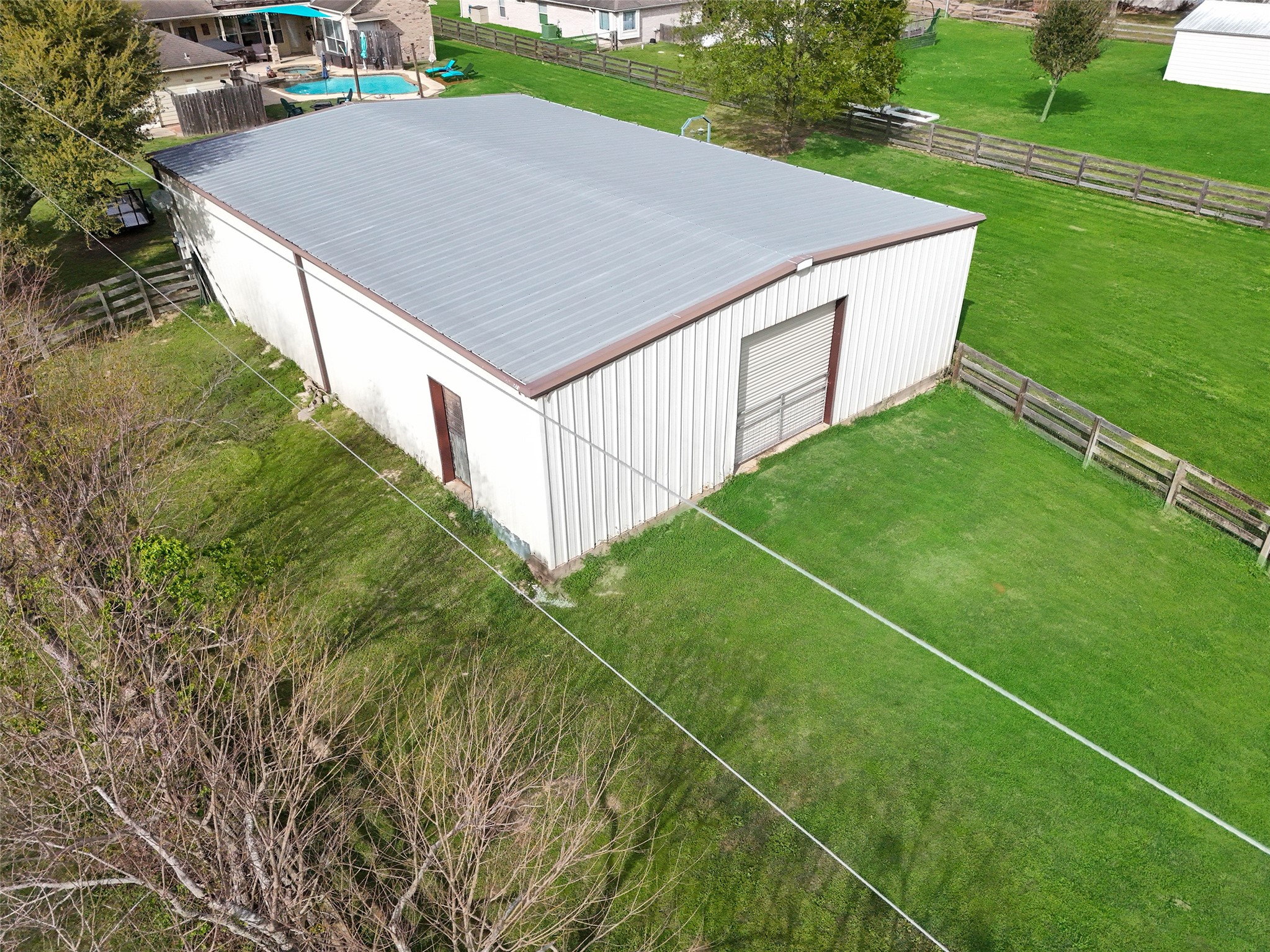 32315 Grove Park Road Waller, TX 77484 - Photo 33 of 40 Two meter poles - one services barn, pool, and septic. The other services the house.