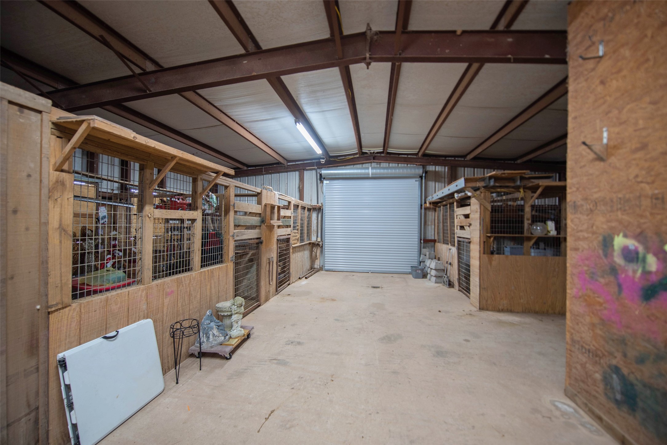 32315 Grove Park Road Waller, TX 77484 - Photo 36 of 40 Concrete flooring with overhead lighting