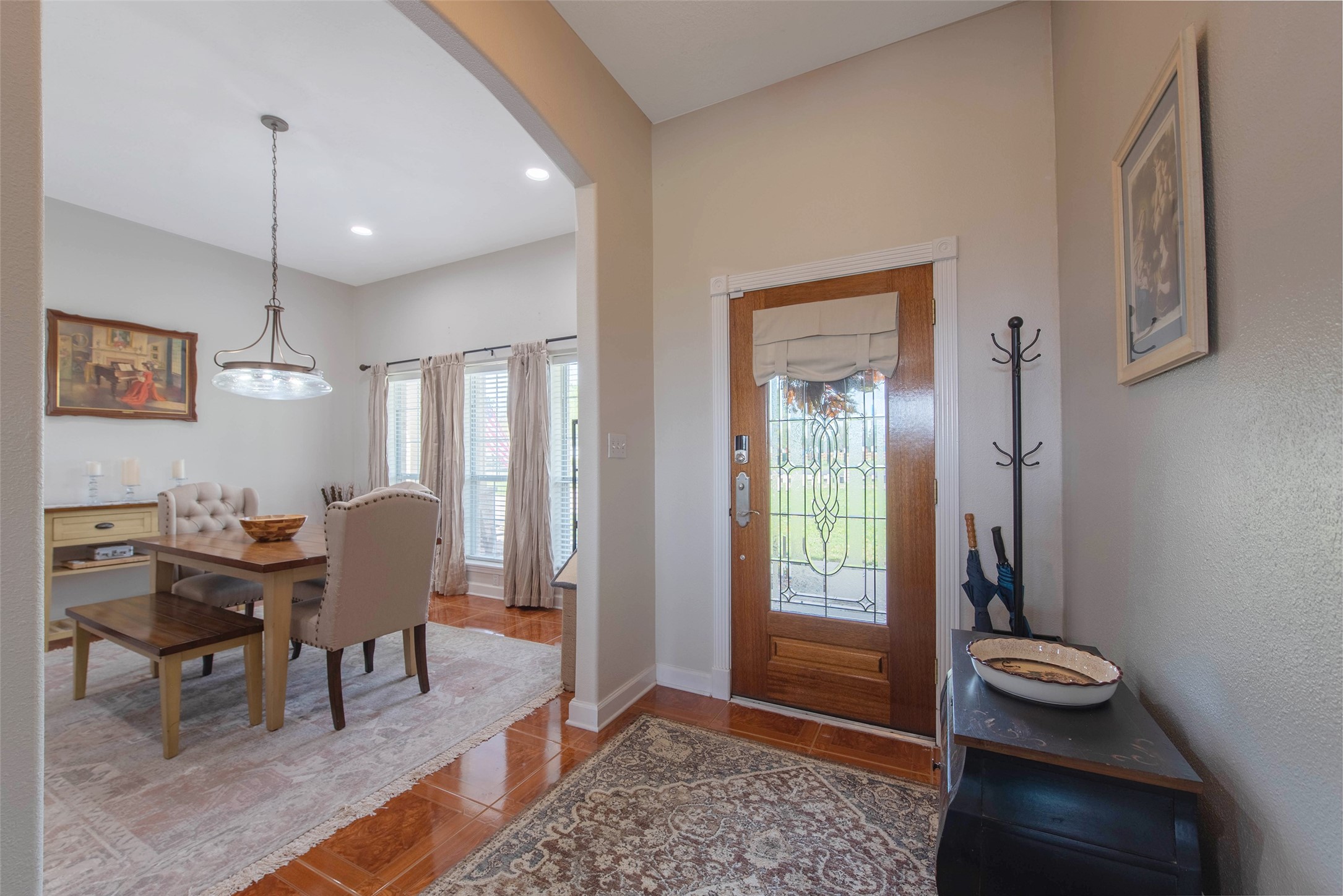 32315 Grove Park Road Waller, TX 77484 - Photo 4 of 40 Bright entryway with decorative glass door flowing into formal dining space.