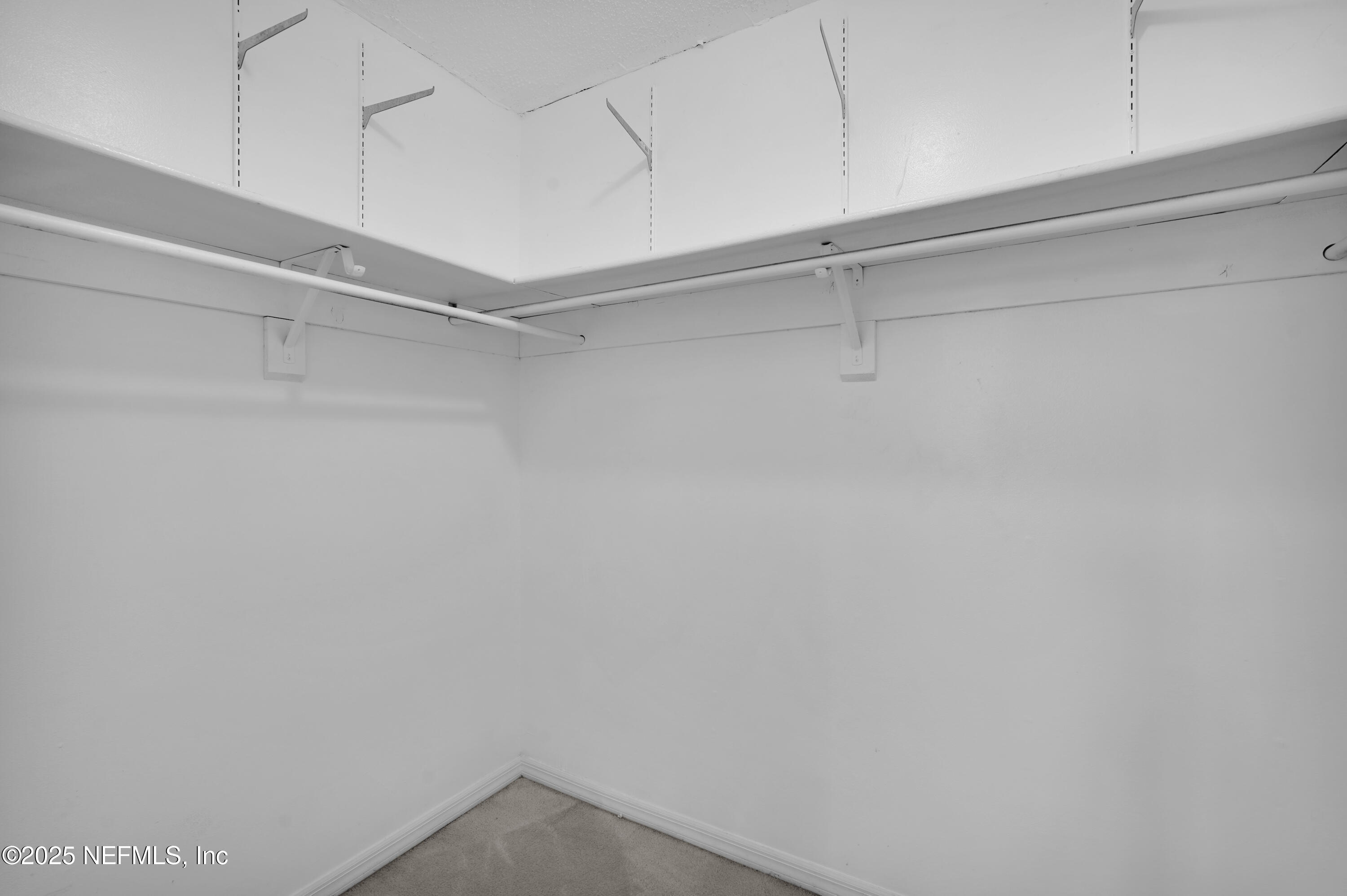 1610 Derringer Road Jacksonville, FL 32225 - Photo 23 of 29 a view of a room with racks on the wall
