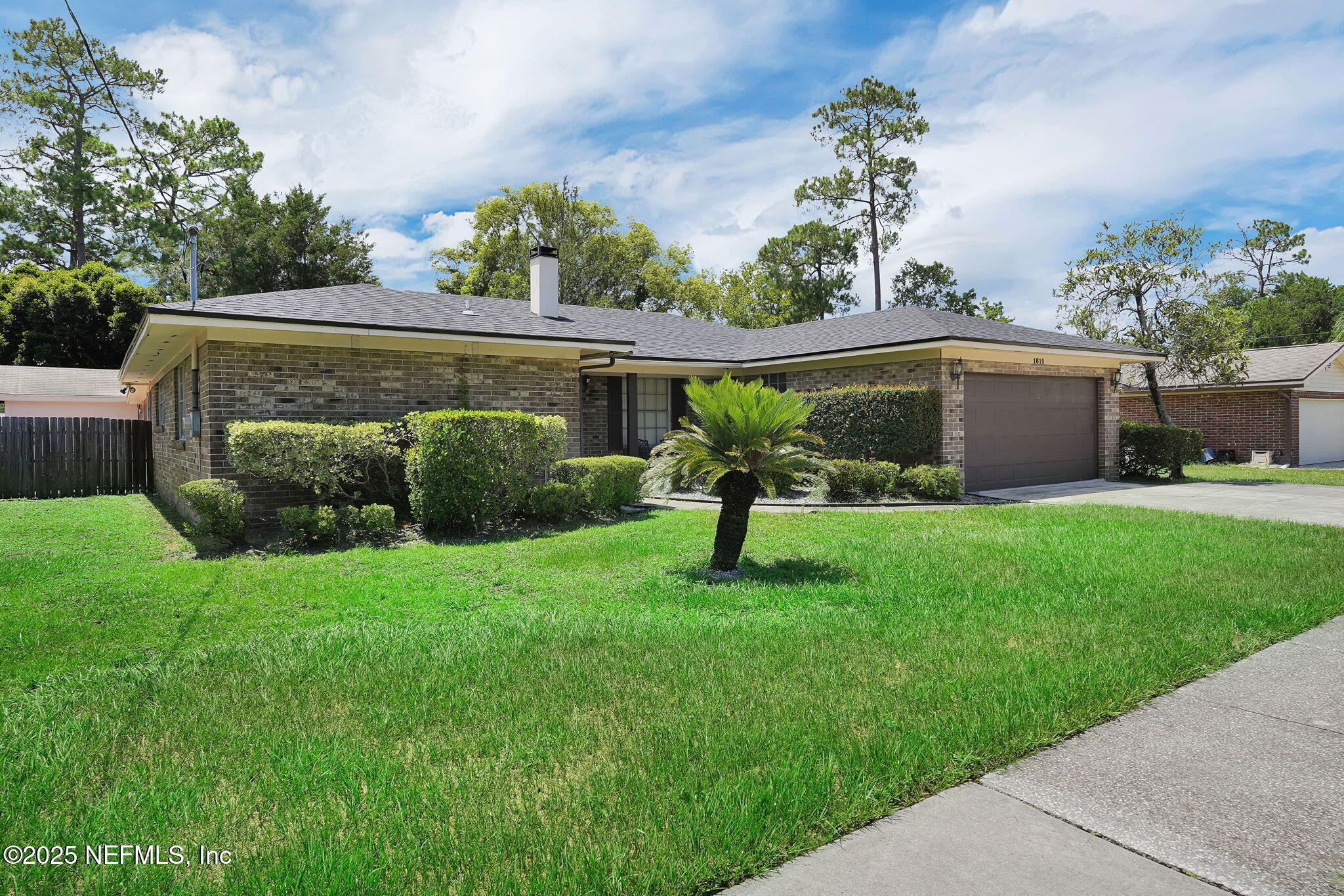 1610 Derringer Road Jacksonville, FL 32225 - Photo 3 of 29 a front view of a house with a garden