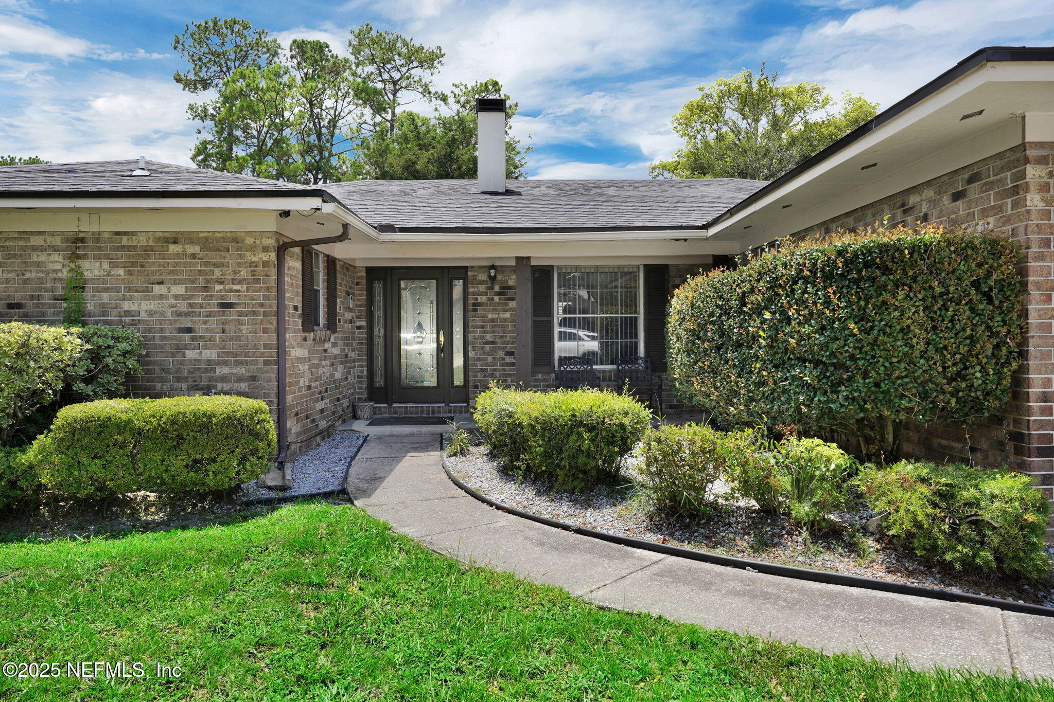 1610 Derringer Road Jacksonville, FL 32225 - Photo 4 of 29 a front view of a house with a yard