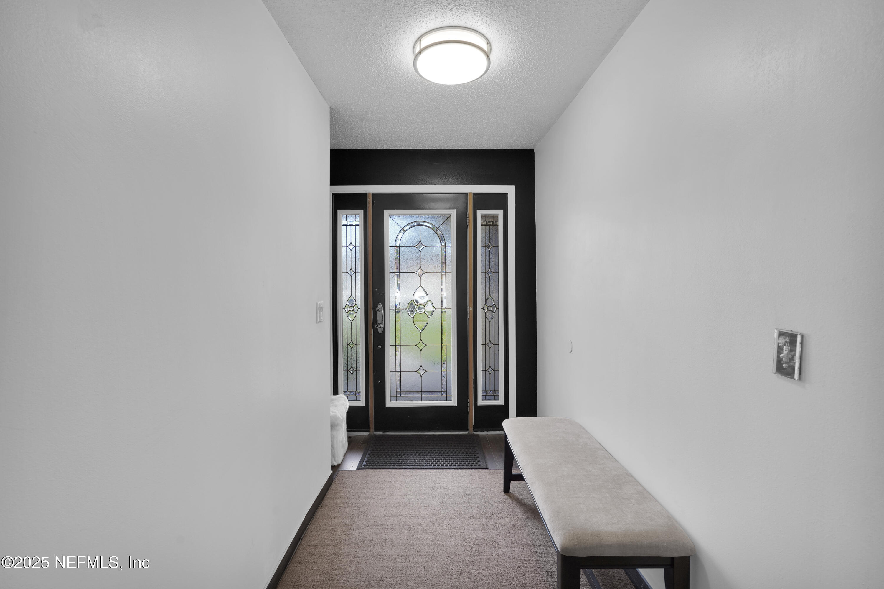 1610 Derringer Road Jacksonville, FL 32225 - Photo 5 of 29 a view of a livingroom with a staircase
