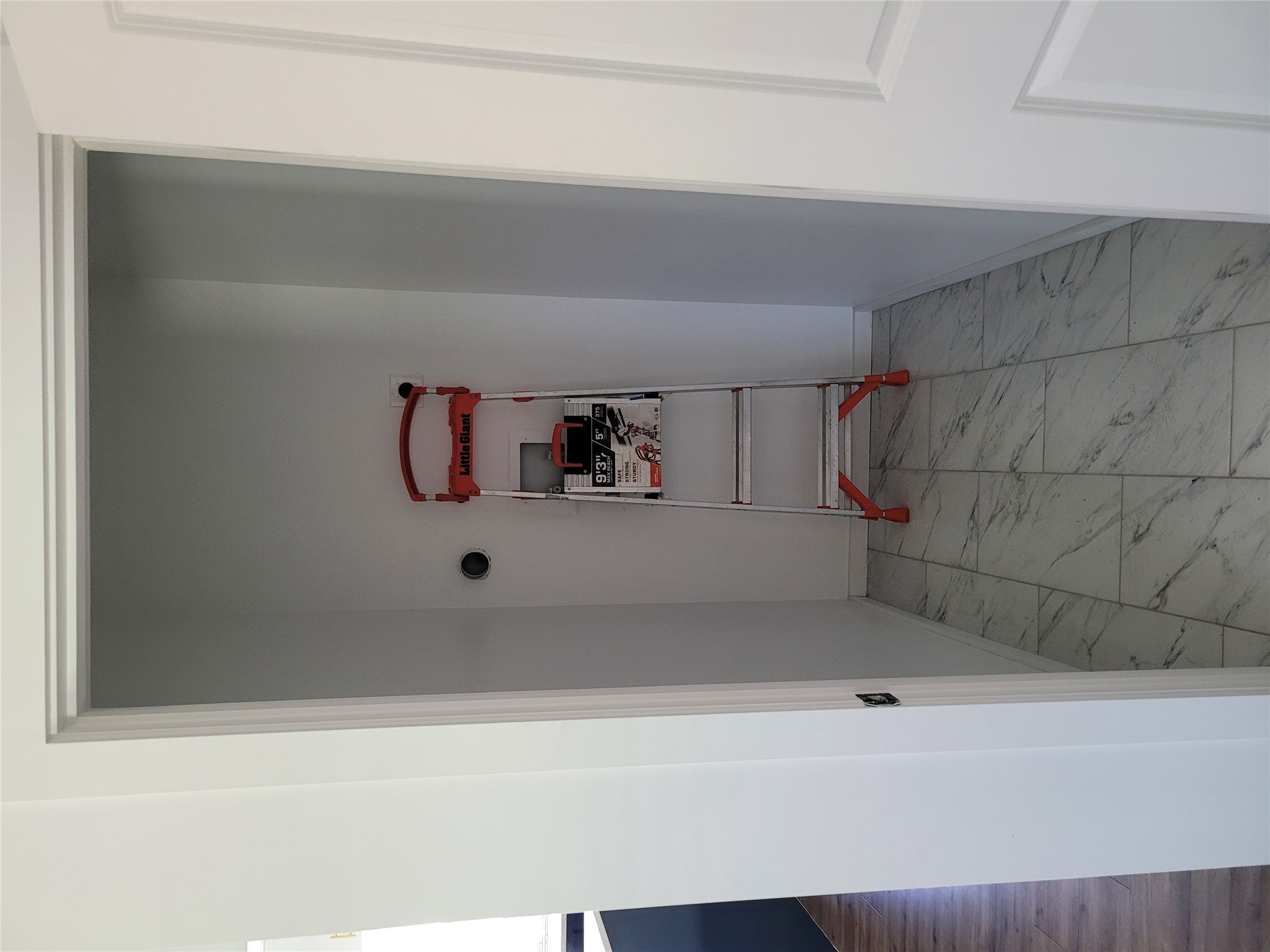 422 A Road Stockdale, TX 78160 - Photo 13 of 40 A dedicated utility closet offers practical space and durable tile flooring.