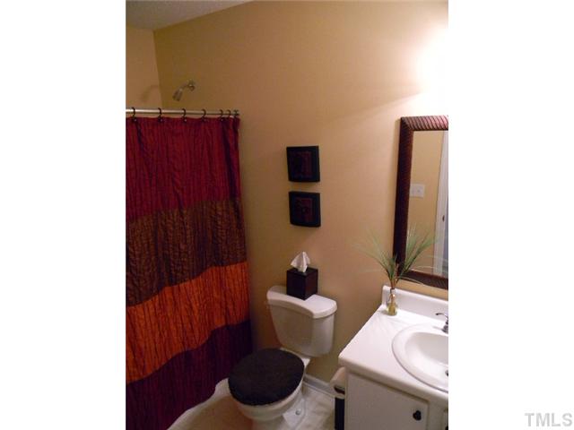 5028 Silverdene Street Raleigh, NC 27616 - Photo 16 of 25 Guest bathroon has a full shower/tub combo!