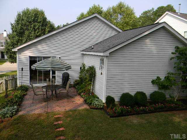 5028 Silverdene Street Raleigh, NC 27616 - Photo 20 of 25 This view of the back of your home really displays the garden areas, patio and a small portion of the usable grassy area...a wonderful place to unwind or enjoy family and friends!