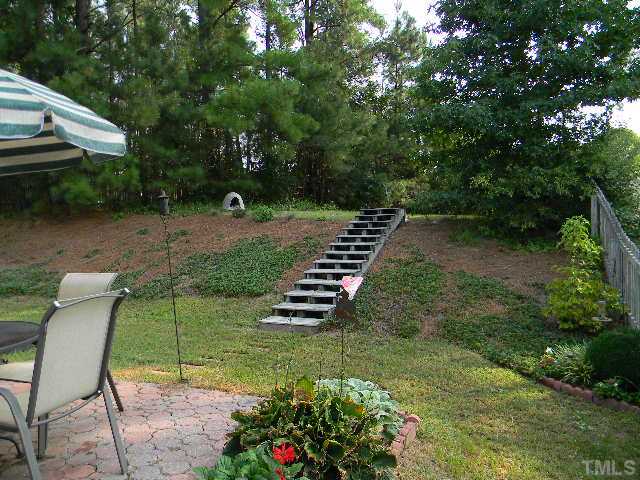 5028 Silverdene Street Raleigh, NC 27616 - Photo 22 of 25 Stairs added at the back make this multi-level yard completely functional and usable!
