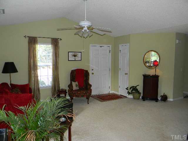 5028 Silverdene Street Raleigh, NC 27616 - Photo 4 of 25 Another view of your living room ... front door w/ hardwood foyer and adjacent coat closet