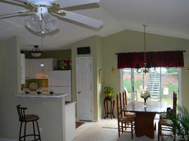 5028 Silverdene Street Raleigh, NC 27616 - Photo 7 of 25 This view displays the connection between the dining room and kitchen - a fantastic flow in this home!