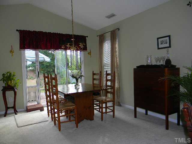 5028 Silverdene Street Raleigh, NC 27616 - Photo 9 of 25 Seperate dining room with direct access to back yard and patio has ample natural light and plenty of space for your furniture!
