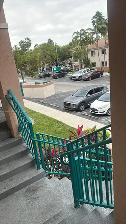 a view of a city street with cars