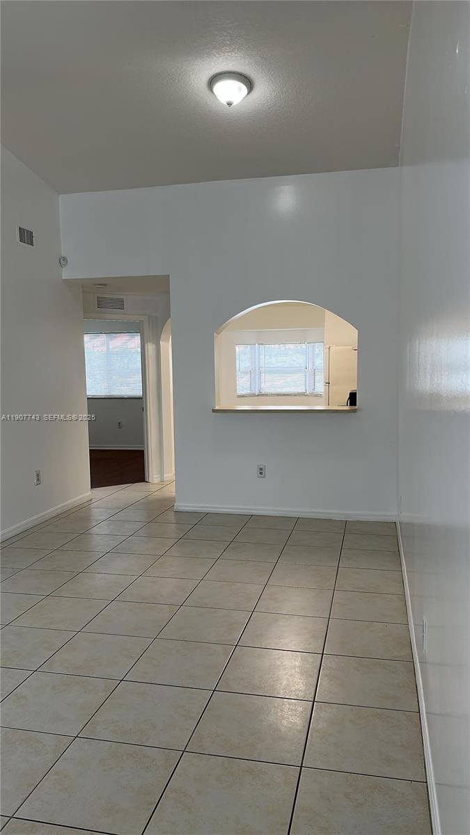 2910 Southeast 12th Road, Unit 20429 Homestead, FL 33035 - Photo 8 of 25 an empty room with a empty space and windows