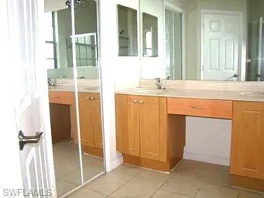 7423 Bristol Circle Naples, FL 34120 - Photo 5 of 6 Bathroom featuring tile patterned floors and vanity