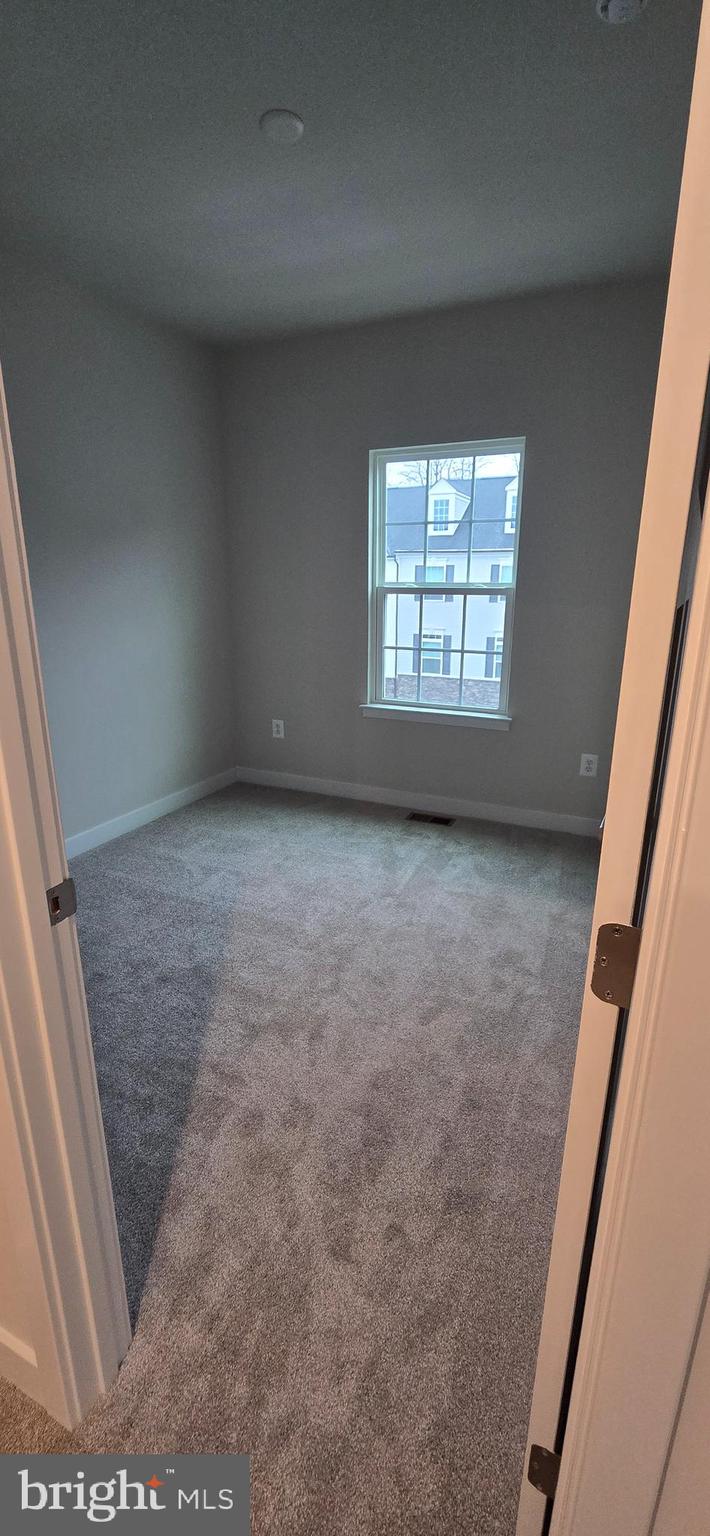 357 Marquis Street Frederick, MD 21702 - Photo 22 of 23 en empty room with windows