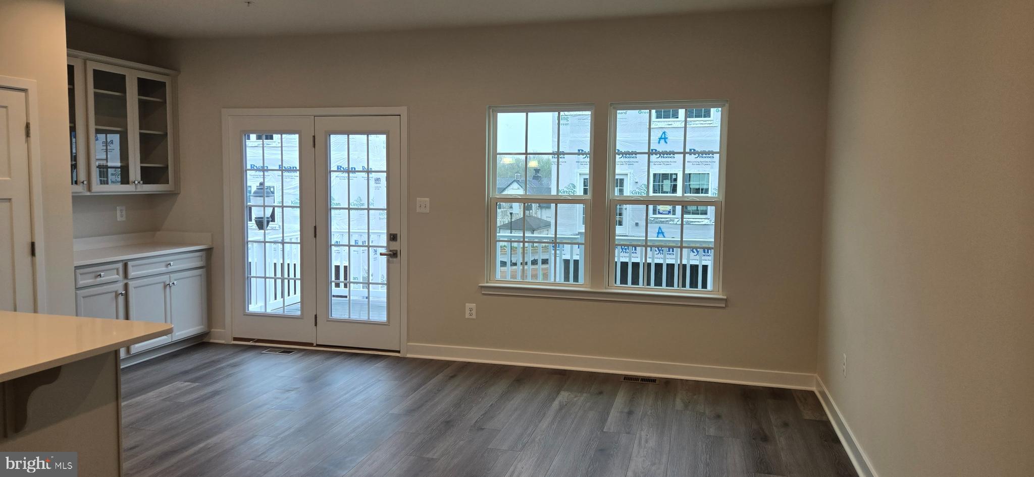 357 Marquis Street Frederick, MD 21702 - Photo 9 of 23 an empty room with wooden floor and windows