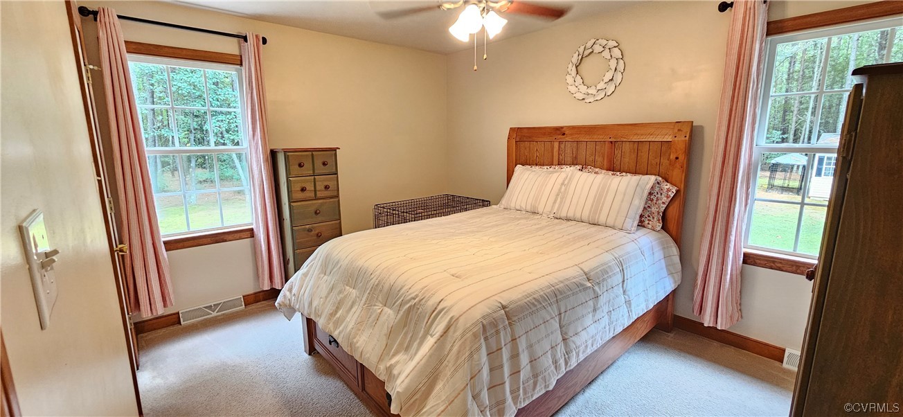 2405 Beulah Church Road St. Stephens Church, VA 23148 - Photo 16 of 18 a bed sitting in a bedroom next to a window