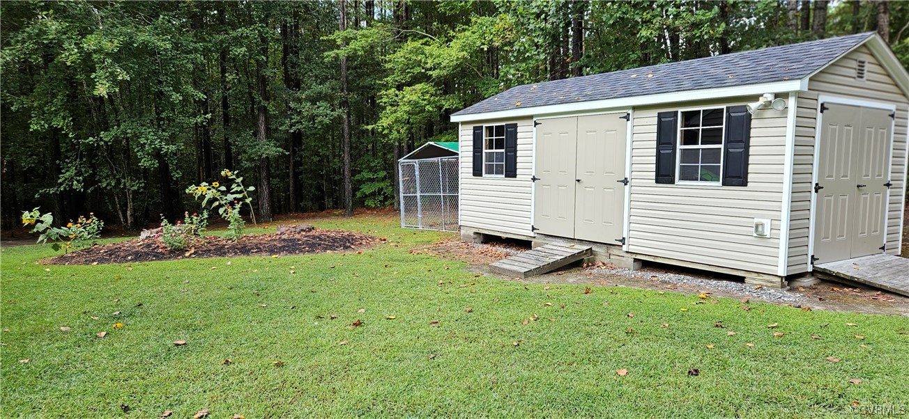 2405 Beulah Church Road St. Stephens Church, VA 23148 - Photo 3 of 18 a view of a back yard of the house