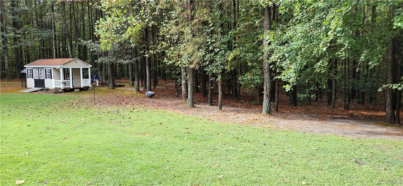 2405 Beulah Church Road St. Stephens Church, VA 23148 - Photo 5 of 18 a view of a house with backyard and sitting area