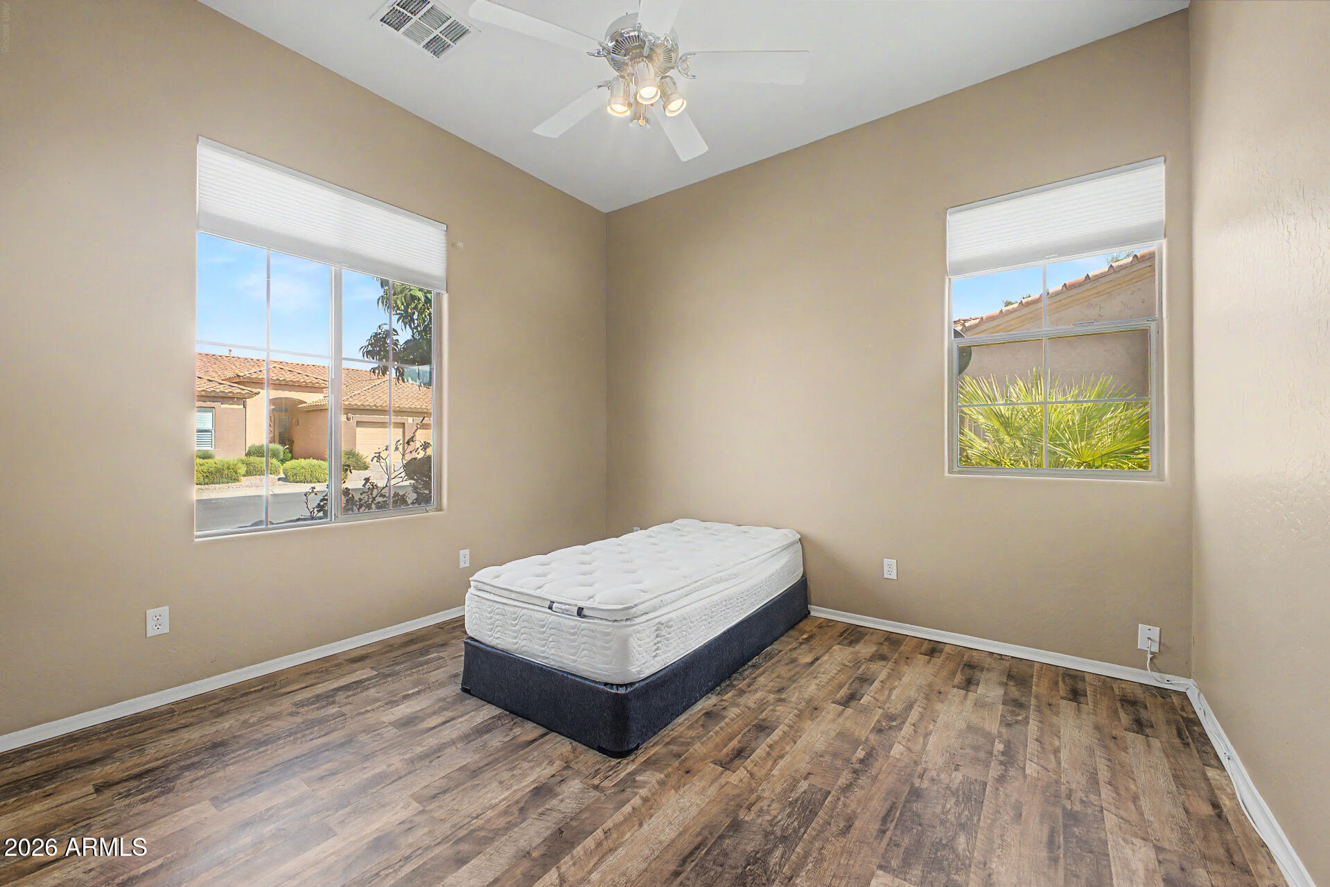 5090 South Ranger Trail Gilbert, AZ 85298 - Photo 20 of 50 an empty room with a window and wooden floor