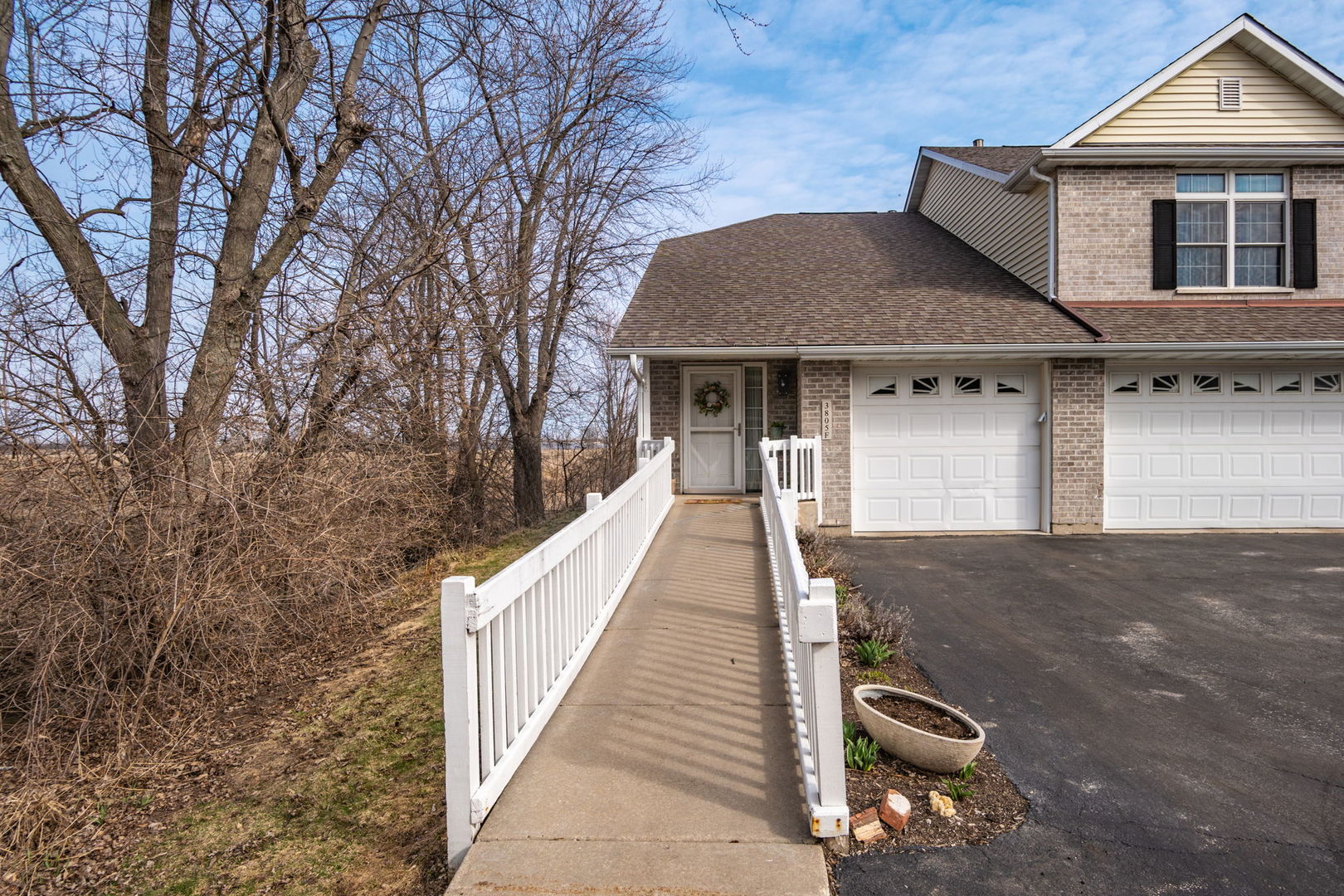 3805 South Pointe Drive, Unit F DeKalb, IL 60115 - Photo 1 of 1 a front view of a house with a yard