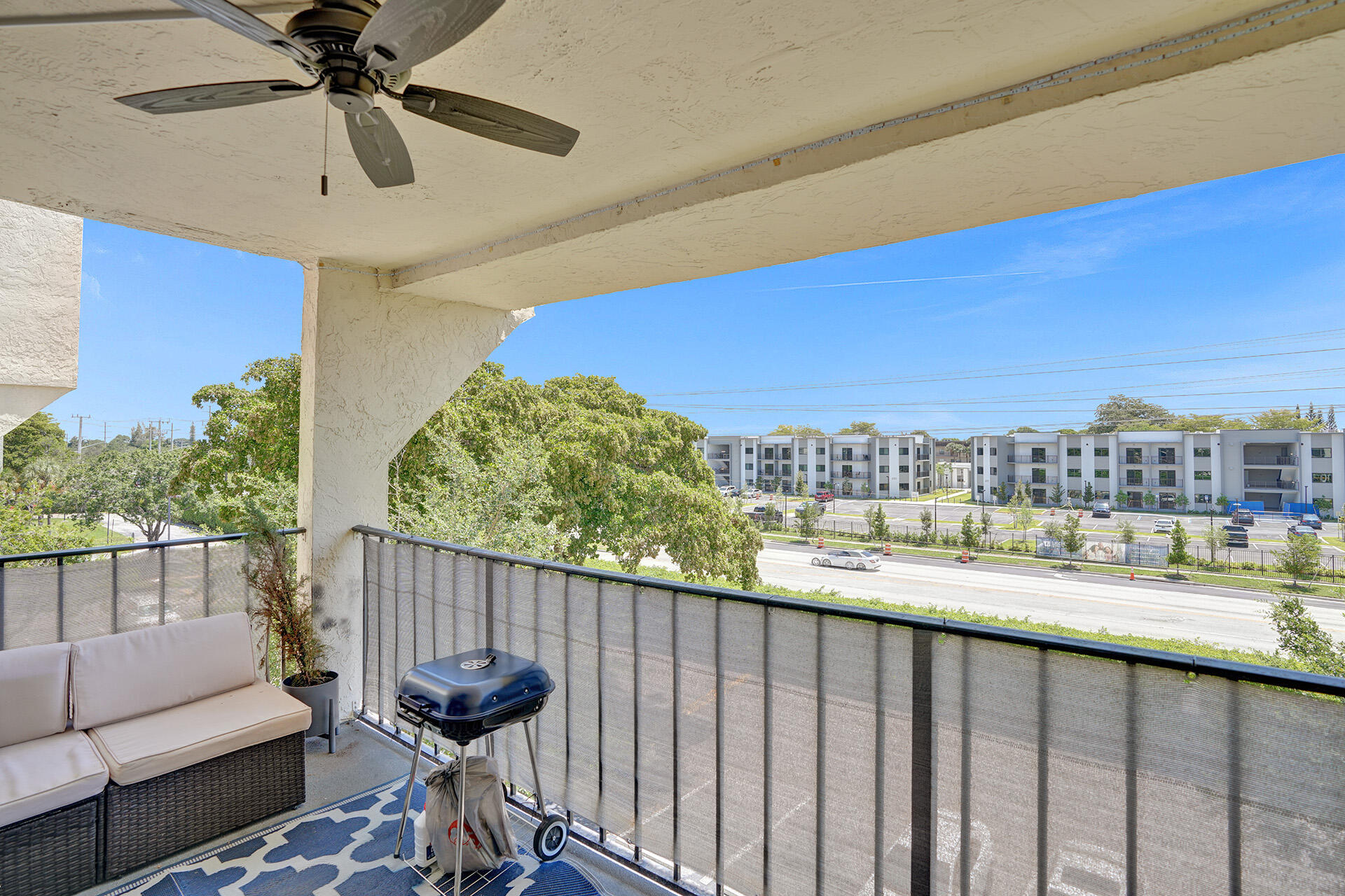 6193 Rock Island Road, Unit 405 Tamarac, FL 33319 - Photo 18 of 42 a balcony with a city view