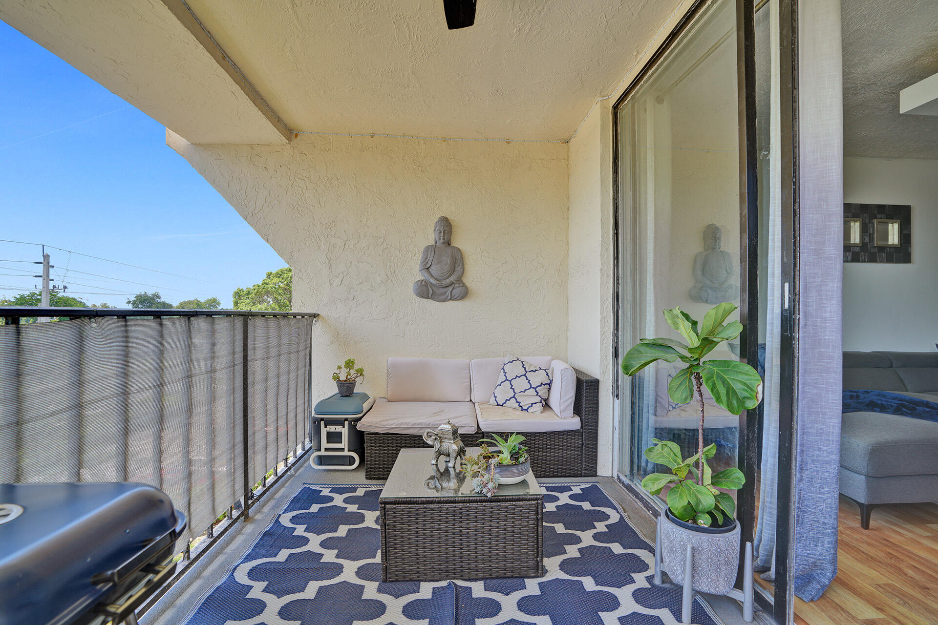 6193 Rock Island Road, Unit 405 Tamarac, FL 33319 - Photo 21 of 42 a living room with furniture and a potted plant